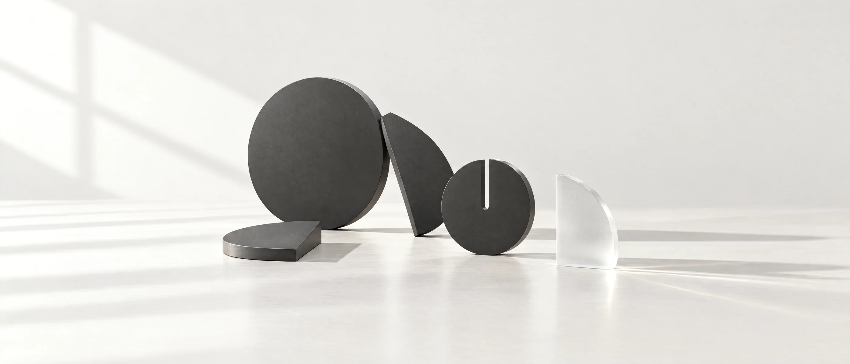Abstract round forms standing in soft window light