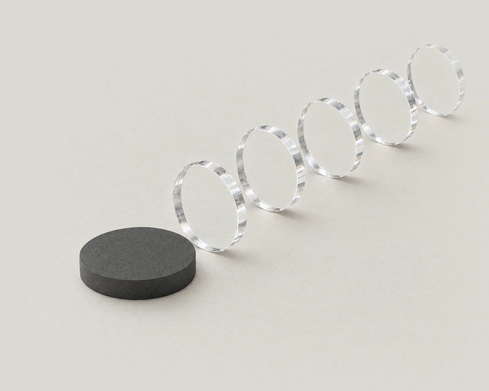 One graphite disc and a curve of glass discs that carry on by themselves